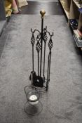 A large wrought iron companion stand and candle holder