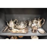 A selection of plated ware, including tray, tea pots, servers and more.