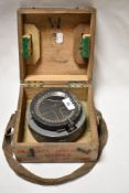 A WW2 British military gimble compass in wooden case, undated, earliest stamp service date reads