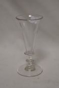 A 19th century ale glass having trumpet bowl on plain stem with two single bladed knops on