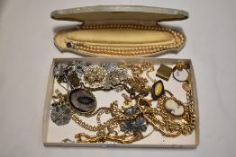 A good selection of yellow metal costume jewellery including necklaces agate brooches and a