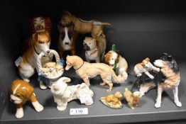 A mixed lot of vintage dog studies, including Beswick West Highland terrier, Hummel dog nursing