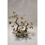 An oriental study of a cherry tree using natural stones and beadwork.
