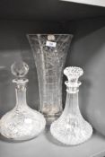 An Edinburgh crystal decanter, a smaller pressed glass example and a large cut glass vase.