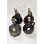 A pair of early Victorian amber glass onion decanters having etched silver tone collars and cork