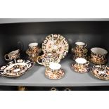 A selection of early 20th century Royal Crown Derby in the Imari palette, to include tea pot, sugar,