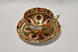 A Royal Crown Derby cup and saucer in the Imari palette, date stamp of 1924.