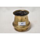 An Ankhora or ritual holy water pot of squat form in bronze or bronze effect metal, with rope like