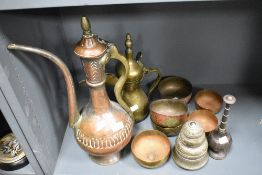 A mixed lot of Middle Eastern metal ware, including copper water jug, Brass Dallah coffee pot, bowls