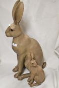Two good quality composite hare ornaments.