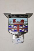 An Austin Healey Club car badge.