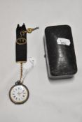 A small Victorian pocket watch having a HM silver chase worked case with an enamel dial