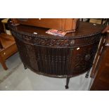 A late 19th or early 20th Century mahogany sideboard/cocktail cabinet, having tambour doors and