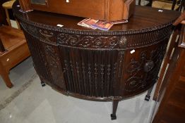 A late 19th or early 20th Century mahogany sideboard/cocktail cabinet, having tambour doors and