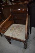 A 19th Century mahogany scroll arm carver chair