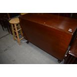 An early 20th Century mahogany gate leg dining table having long drop flaps