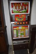 A 1980's Fruit Machine, Pussy Cat, 10p per play, height 180cm, width 55cm, we don't test for