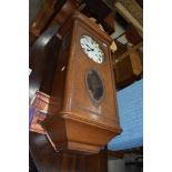 An early 20th Century oak cased wall clock