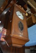 An early 20th Century oak cased wall clock