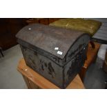 A vintage metal dome topped trunk