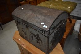 A vintage metal dome topped trunk