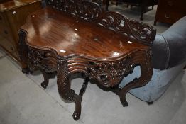 A 19th Century console/dressing table having foliate carved decoration