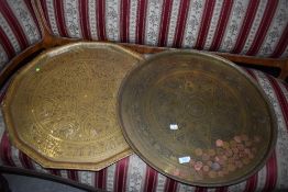 Two Eastern style brass trays of large proportions, , for scale circular one is approx. 57cm in