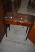 A 19th Century mahogany fold over tea or car table having leather top (af)