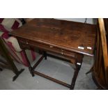 A 19th Century oak side table having frieze drawer