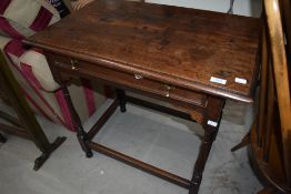 A 19th Century oak side table having frieze drawer