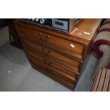 A vintage teak and laminate low chest of drawers