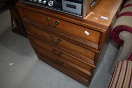 A vintage teak and laminate low chest of drawers