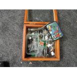 A small wooden and glazed display case containing Lead Figures and Accessories, Acme Whistle,