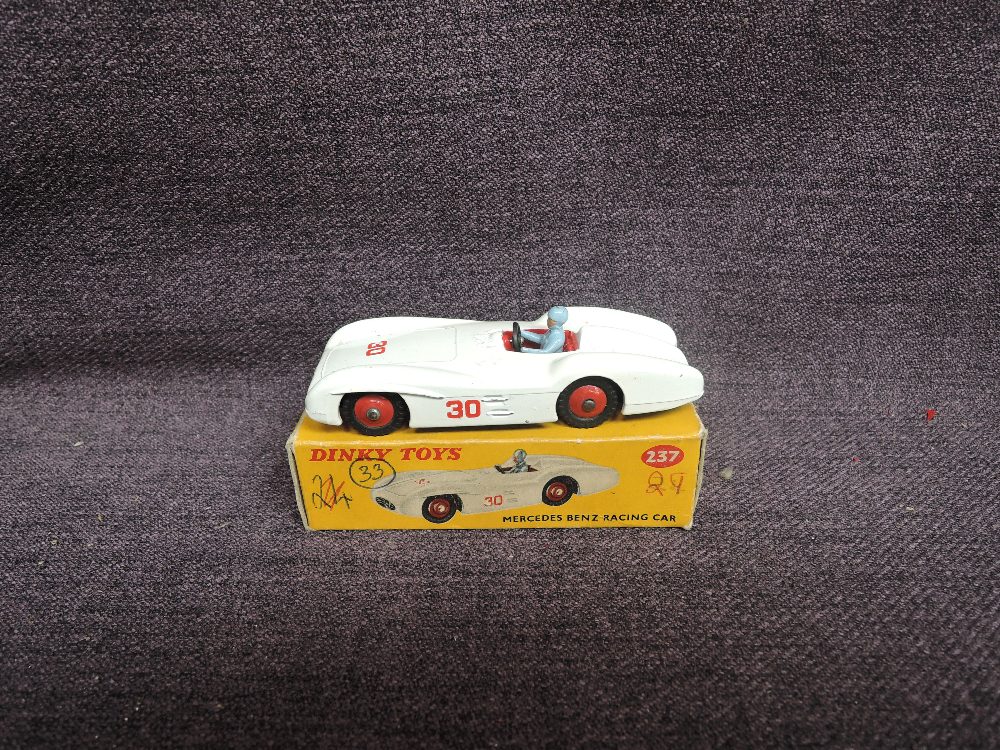 A Dinky diecast, 237 Mercedes Benz Racer, White with Red Hubs in original box