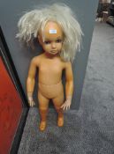 A vintage Child Shop Mannequin wearing a wig, height approx 80cm