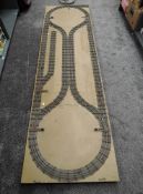 A 0 Gauge Three Rail Folding Layout on wooden folding trestle table, approx 270cm x 80cm