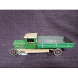 A 1930's Wells clockwork and tinplate Tipping Wagon in green and cream