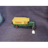 A 1930's Well Toys tinplate and clockwork Express Transport Van in green and yellow, number plate