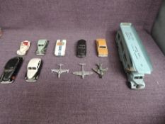 Eleven playworn Dinky diecasts, 40A Riley Saloon, 108 MG Midget, 133 Cunningham C-SR, 139B Hudson