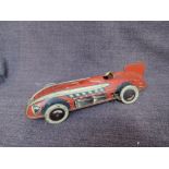 A 1930's Wells Toys tinplate and clockwork Racing Record Car in red, missing driver