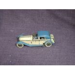 A 1930's Wells clockwork and tinplate Rolls Royce Sedan Car in blue and cream, clockwork af