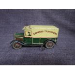 A 1930's Well Toys tinplate and clockwork Express Transport Van in green and yellow, number plate