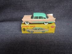 A Dinky diecast, 178 Plymouth Plaza, Pink & Green in original correct spot box