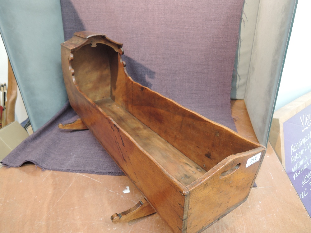 A late 19th/early 20th century wooden Dolls Crib, on traditional rocker base, length approx 66cm