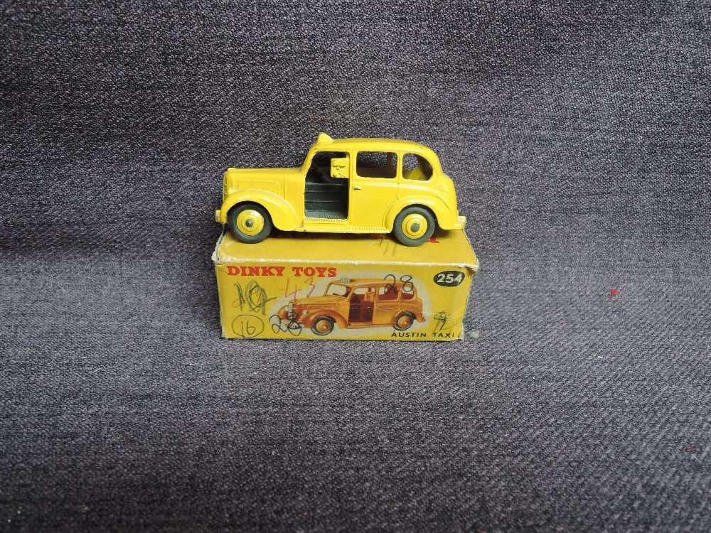 A Dinky diecast, 254 Austin Taxi, Yellow, in original box, missing end flaps