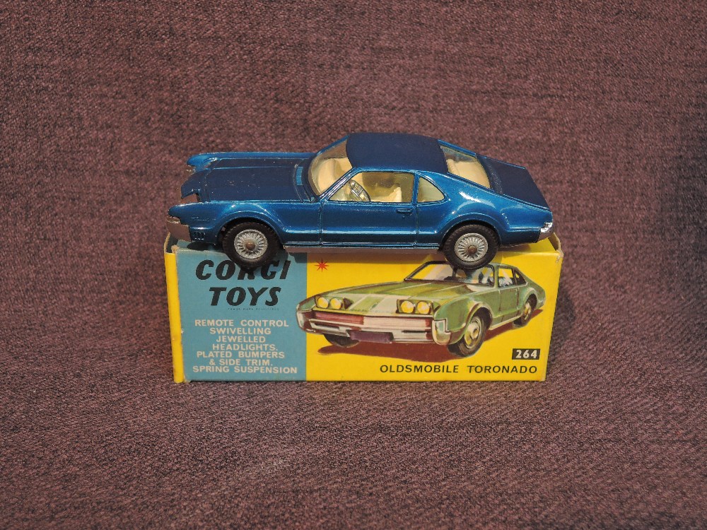 A Corgi diecast, 264 Oldsmobile Toronado in metallic dark blue with white interior, in original box