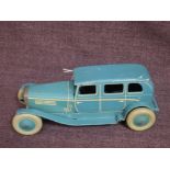 A 1930's Chad Valley clockwork and tinplate saloon car in light blue with cream trim, no key