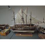 A wooden scale model of 1749 Royal Caroline British Royal Yacht, on wooden and brass display