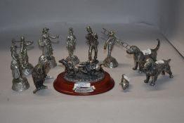 A selection of metal and pewter cast figures including five Cries of London series