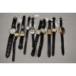 Ten ladies/girls fashion watches, all with black straps.